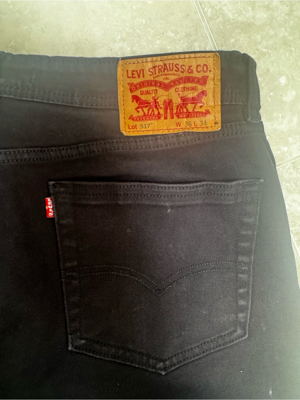 Levi's Men's Slim Straight Black Jeans with Tan Leather Patch